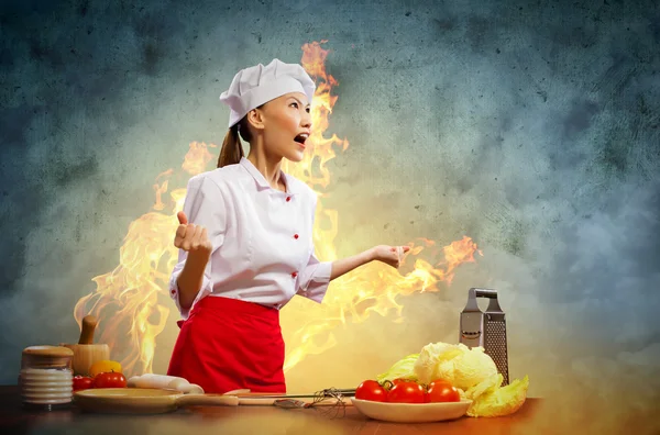 Asian female cook in anger — Stock Photo, Image