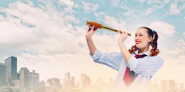 Woman looking in telescope — Stock Photo, Image