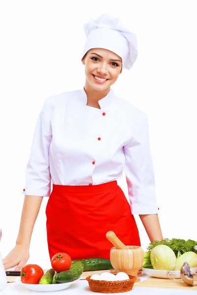 Jovem cozinheiro preparando alimentos — Fotografia de Stock