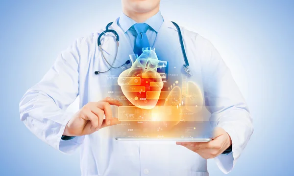 Doctor holding tablet pc — Stock Photo, Image