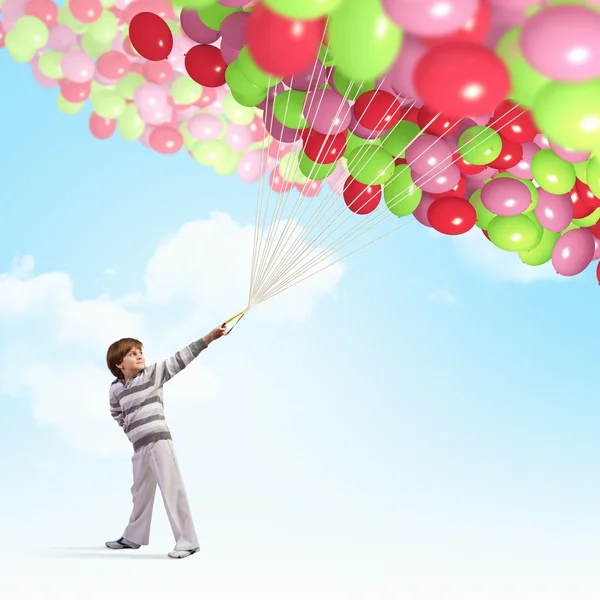 Lindo chico con globos —  Fotos de Stock