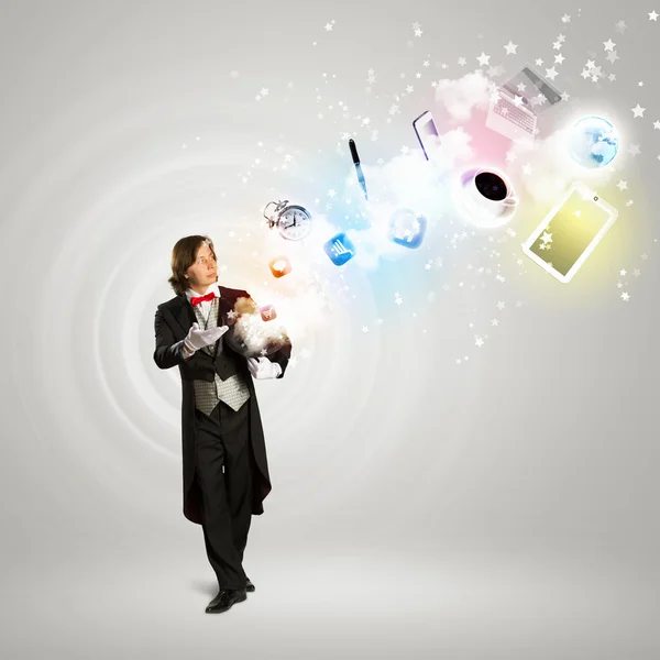 Magician and computer devices — Stock Photo, Image