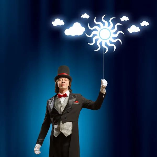 Magician in hat Royalty Free Stock Photos