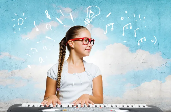 School girl with piano — Stock Photo, Image