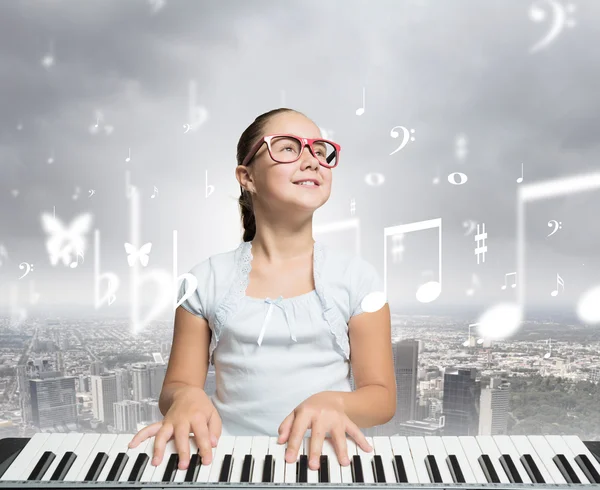 School girl with piano — Stock Photo, Image