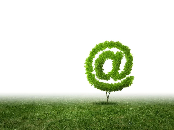 Conceptual image of green plant shaped like email sign — Stock Photo, Image