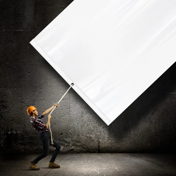 Engineer with banner — Stock Photo, Image
