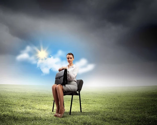 Businesswoman  on chair — Stock Photo, Image