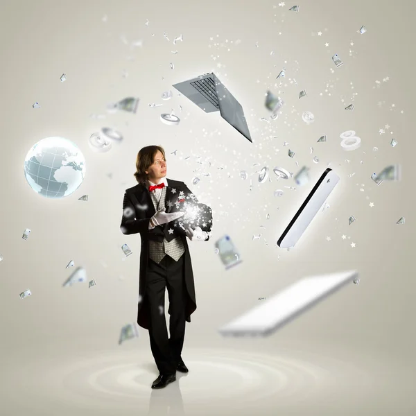 Magician and computer devices — Stock Photo, Image