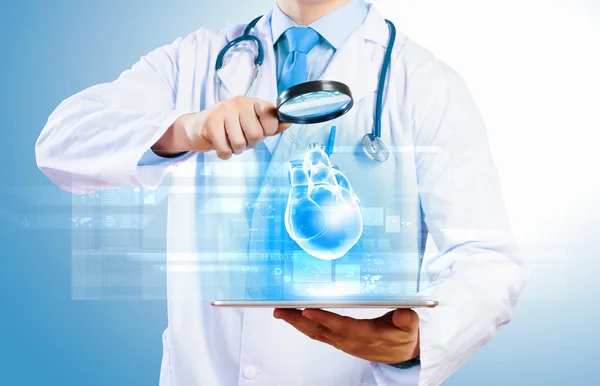 Doctor holding tablet pc — Stock Photo, Image