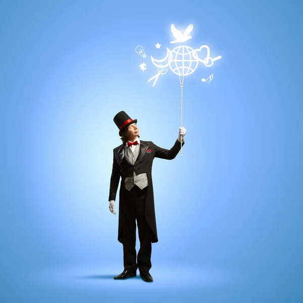 Magician with globe Royalty Free Stock Images
