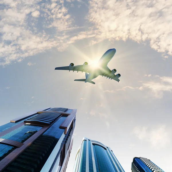 Avião acima da cidade — Fotografia de Stock