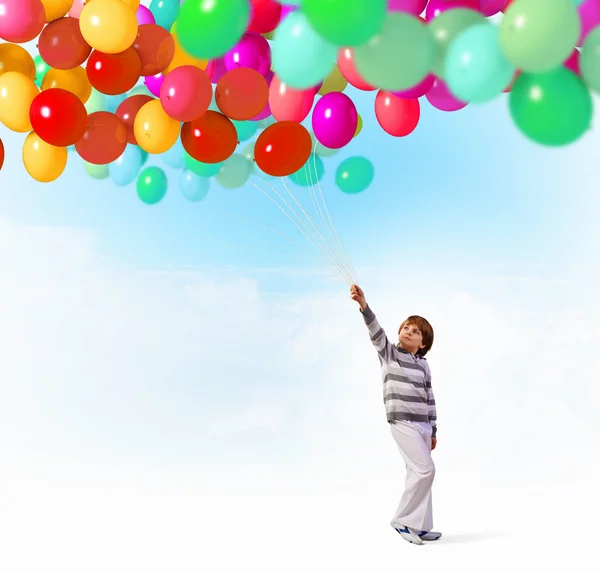 Little girl holding balloons — Stock Photo © SergeyNivens 30808603