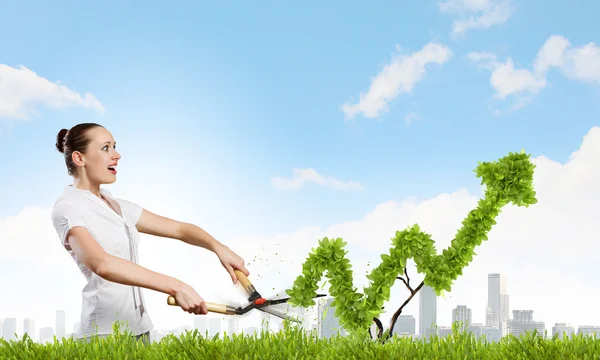 Woman cutting bush — Stock Photo, Image