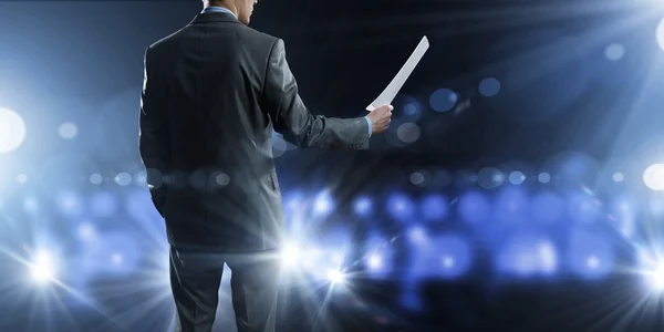 Business man on stage — Stock Photo, Image