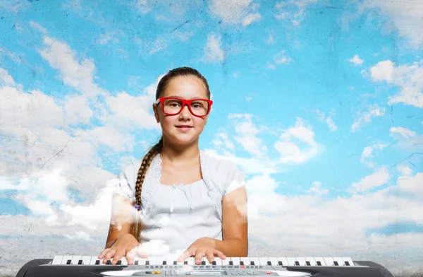 School girl with piano — Stock Photo, Image