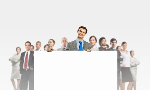 Businessman with blank banner — Stock Photo, Image