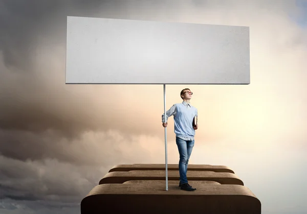 Teenager with banner — Stock Photo, Image