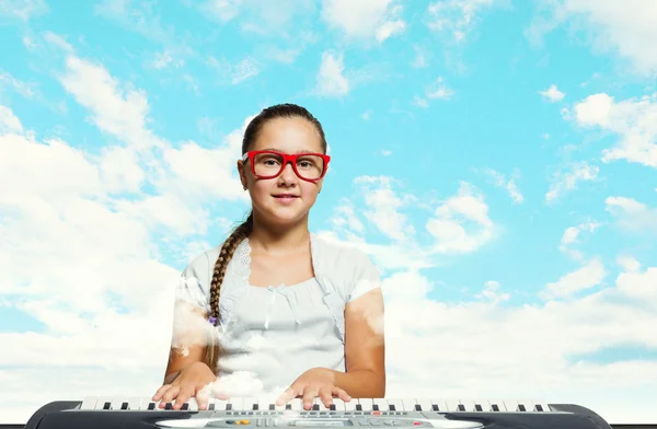 School girl with piano — Stock Photo, Image