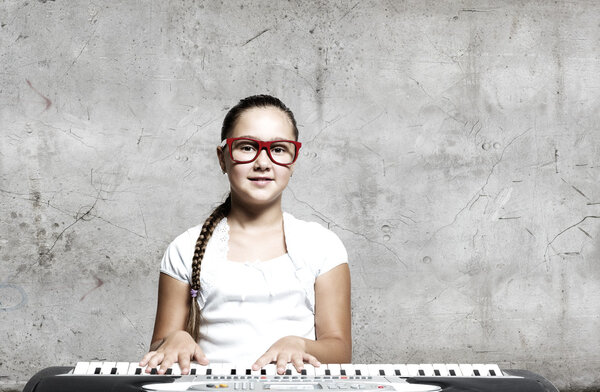 School girl with piano