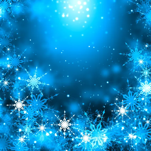 Снежинки на голубом — стоковое фото