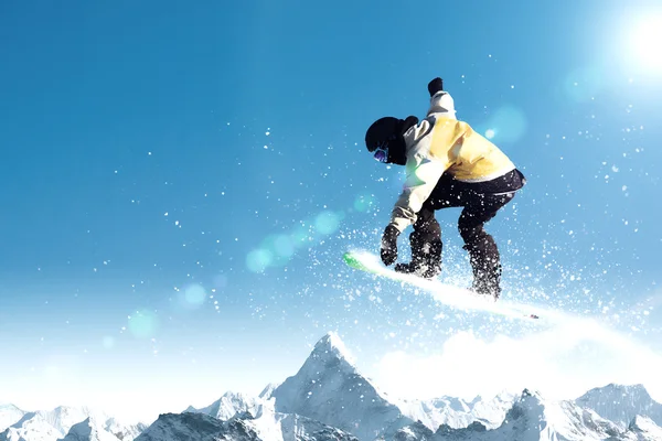 Snowboarding in mountains — Stock Photo, Image