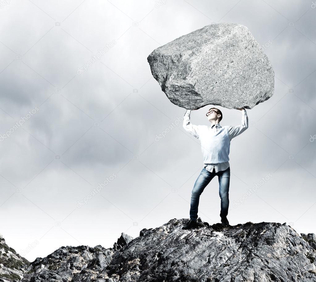 Guy lifting stone