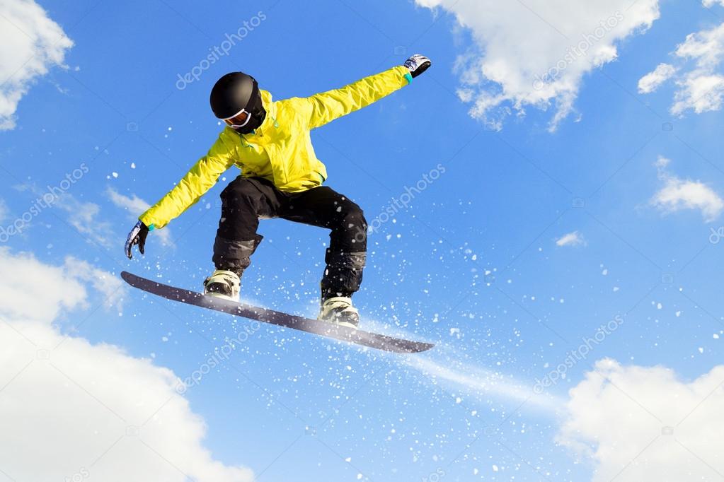 Snowboarding in mountains