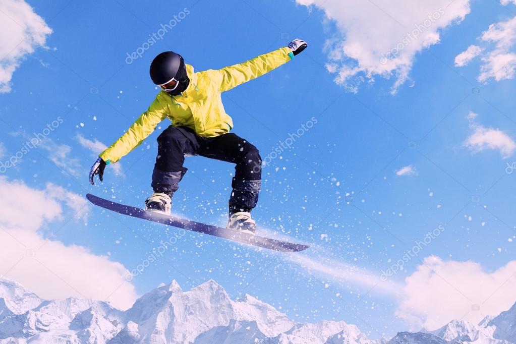 Snowboarding in mountains