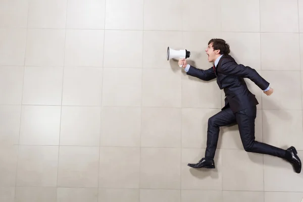 Businessman with megaphone — Stock Photo, Image