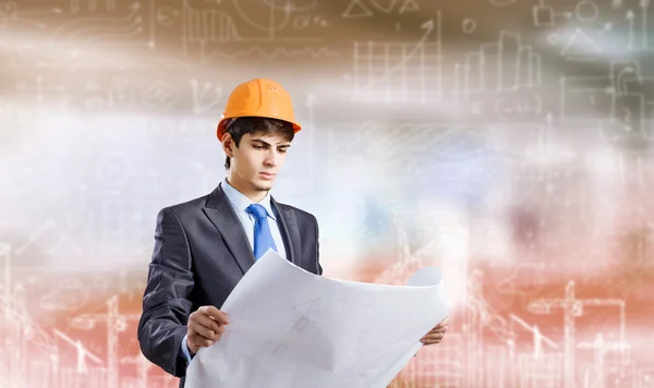 Architect looking at construction project — Stock Photo, Image