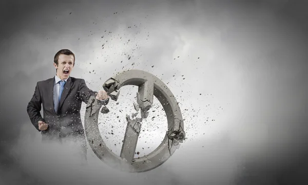 Businessman crashing stone prohibition symbol — Stock Photo, Image