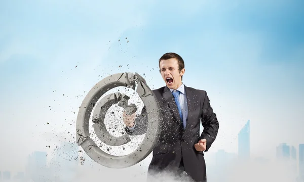Businessman crashing stone trademark — Stock Photo, Image