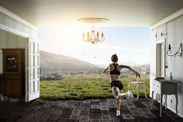 Woman running against natural landscape — Stock Photo, Image
