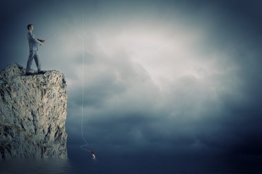 işadamı çubuk ile Balık tutma