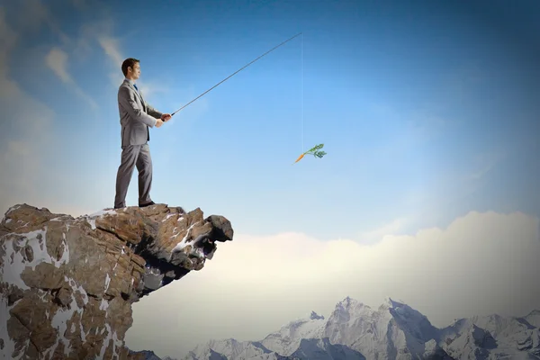 Businessman fishing with rod — Stock Photo, Image