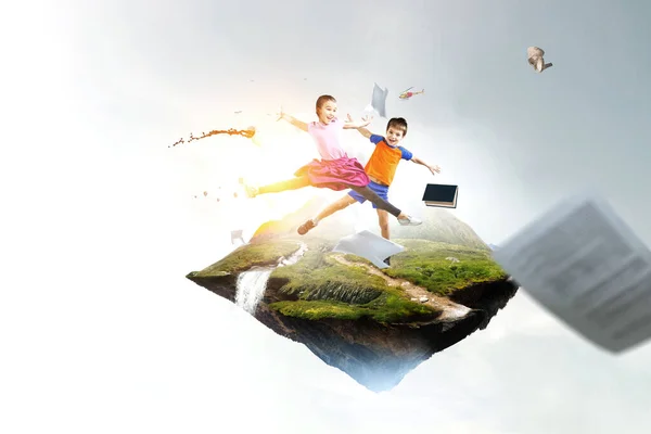 Kids jumping in the sky — Stock Photo, Image