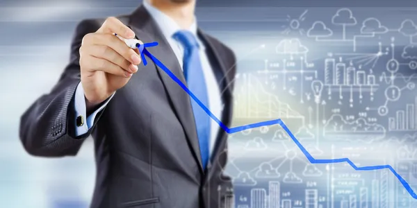 Businessman drawing increasing graph — Stock Photo, Image