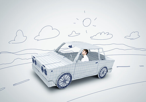 Человек за рулем автомобиля
