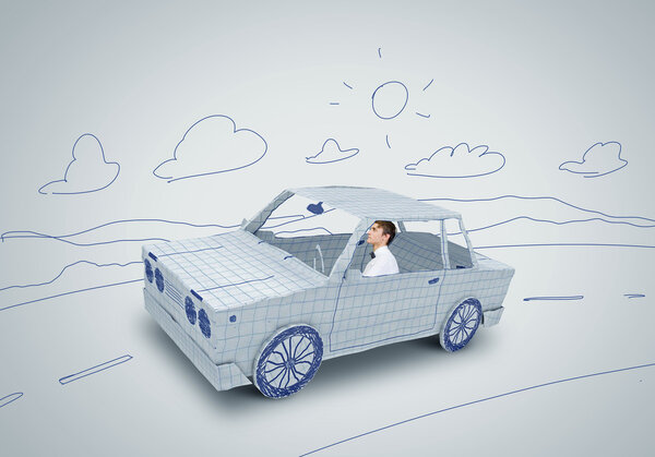 Человек за рулем автомобиля
