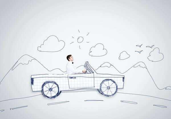 Человек за рулем автомобиля
