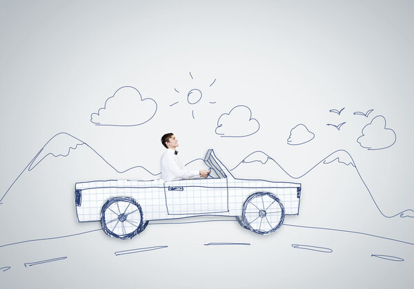 Человек за рулем автомобиля
