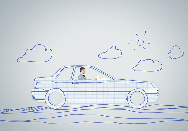 Человек за рулем автомобиля
