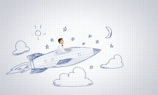 Businessman flying on drawn rocket — Stock Photo, Image