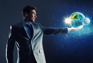 dünya gezegen elinde tutan işadamı