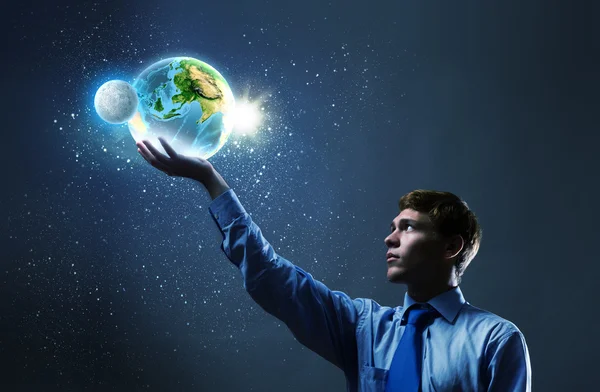 Businessman holding Earth planet in hand — Stock Photo, Image