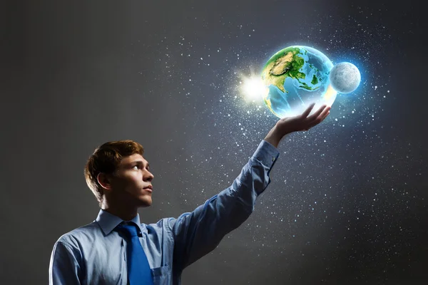 Businessman holding Earth planet in hand — Stock Photo, Image