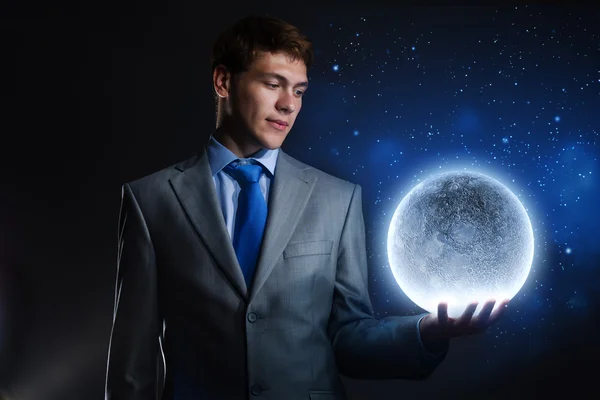 Businessman holding moon planet — Stock Photo, Image