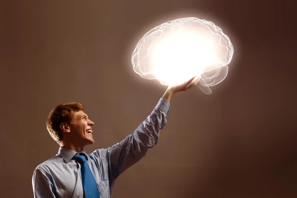 Man holding image of human brain — Stock Photo, Image