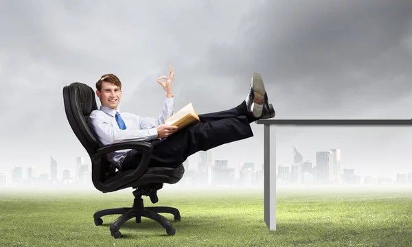 Businessman sitting in chair — Stock Photo, Image